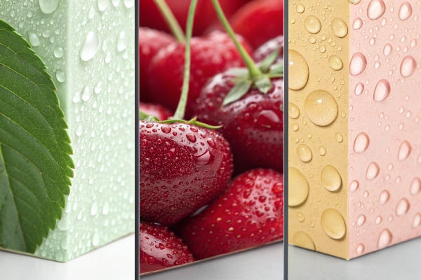 Close-up of packaging with water droplet textures and fruit print