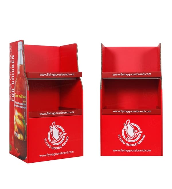 Front and side profile view of the red corrugated floor stand for retail environments.