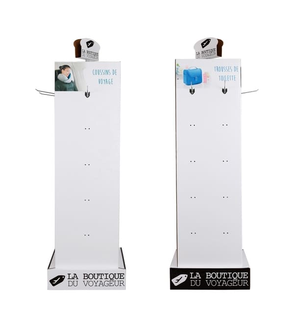 Front and side view of a 4-sided corrugated peg hook stand showing travel pillow and toiletry bag sections.