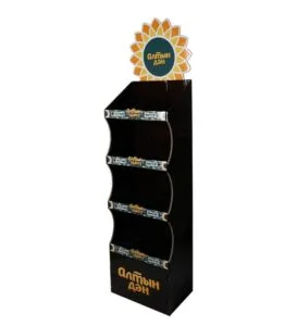 Custom black 4-tier cardboard floor display with a sunflower-shaped header for snack merchandising.