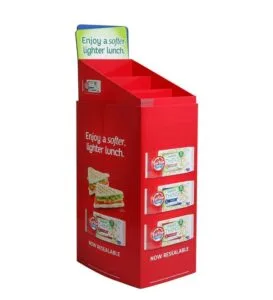 A 3-tier red cardboard display for Tip Top Thins bread products featuring a slanted shelf design for high visibility in retail stores.