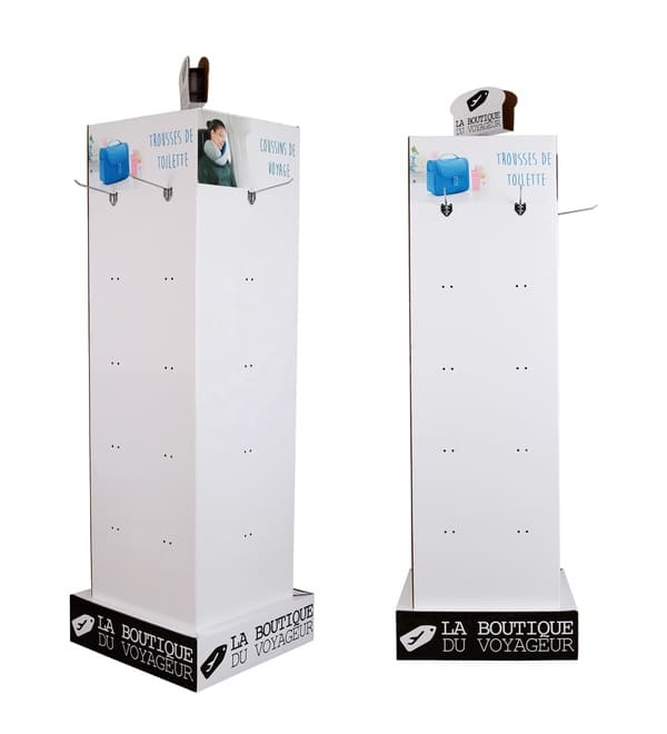 Close-up of a hanging merchandise cardboard fixture highlighting the durable metal hooks and custom printed travel headers.