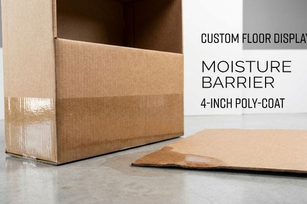 A 4-inch Poly-Coat Moisture Barrier protects a Custom Floor Display from water, unlike a wet cardboard piece.