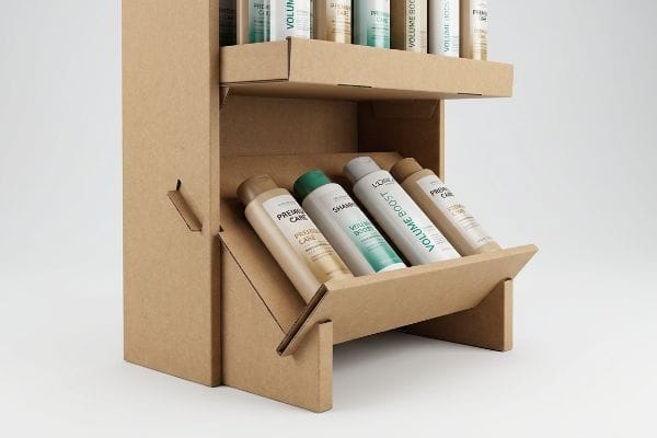 Brown corrugated cardboard display with 15-degree angled lower shelves showcasing Premium Care and Volume Boost shampoo bottles for visual merchandising.