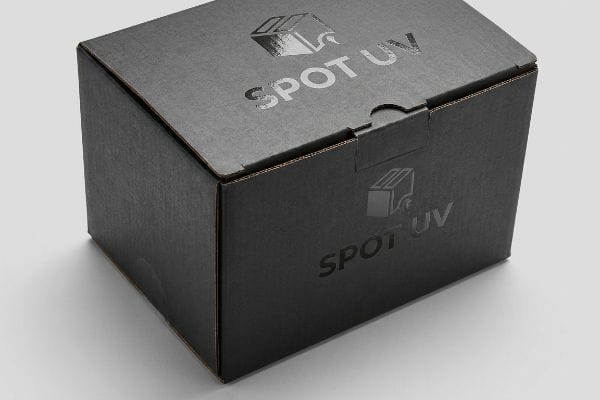 A black corrugated cardboard box featuring a glossy Spot UV finish on the