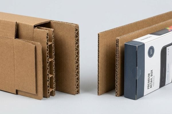 Perfiles de cartón corrugado marrón, incluyendo cartón grueso de flauta B y cartón fino de flauta E, junto a una caja de venta al por menor de primera calidad.