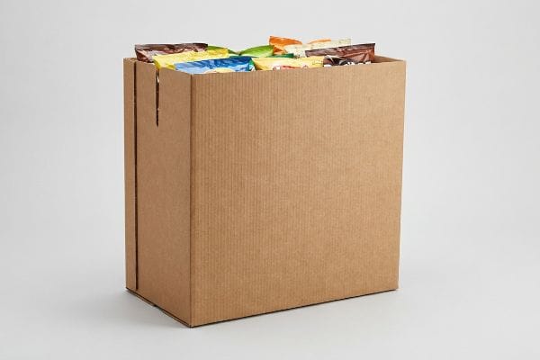 Brown corrugated open-top retail bin, an HSC, filled with various packaged snacks.