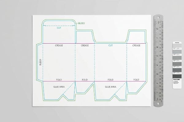 Technical dieline layout for packaging, showing Cut, Crease, Bleed, Fold, and Glue Area lines, with a ruler and Pantone swatch.