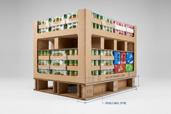 Corrugated cardboard club store display unit holding canned goods and beverage multipacks, featuring 2500 Lbs Dynamic Load and a Double-Wall Spine.