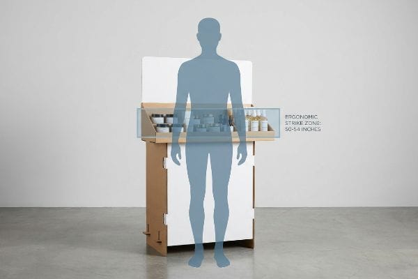 Corrugated cardboard retail display with products, highlighting the