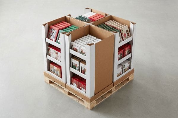 Cardboard fractional merchandising unit on a wooden pallet, displaying seasonal products.