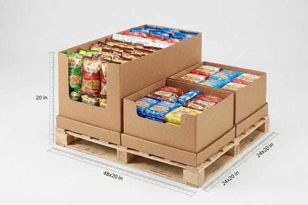 Corrugated half (48x20) and quarter (24x20) pallet displays, 20 inches tall, filled with snacks on wooden pallets.
