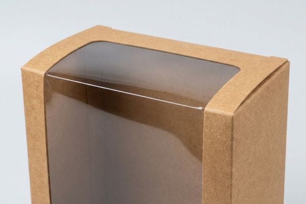 Brown Kraft board display case featuring a clear flexible window patch with rounded top corners.