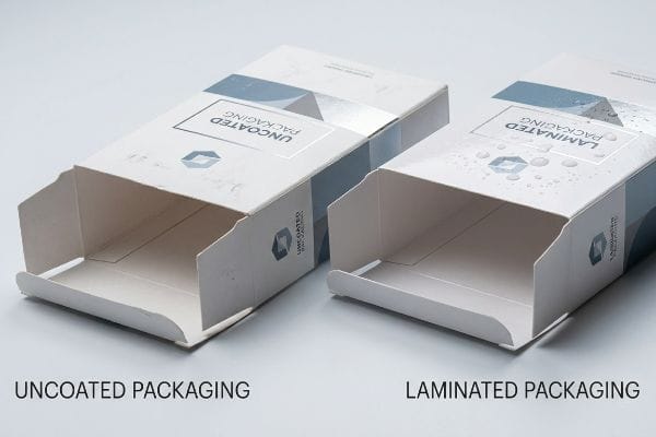 White open-ended Uncoated Packaging and Laminated Packaging boxes, the latter showing water droplets for moisture resistance.