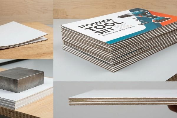 Caja plegable de cartón en capas con núcleo marrón, que muestra una pila de expositores impresos con la leyenda "Juego de herramientas eléctricas" y su grosor estructural.
