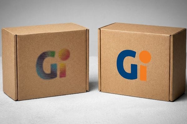 Two brown corrugated boxes, one with a blurry CMYK 'Gi' logo and the other with a crisp PMS spot color 'Gi' logo.