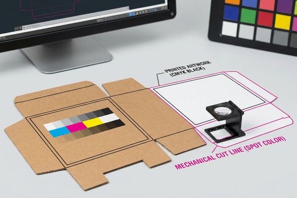 Corrugated cardboard dieline with CMYK color bar, Printed Artwork (Cmyk Black), and a loupe on a Mechanical Cut Line (Spot Color).