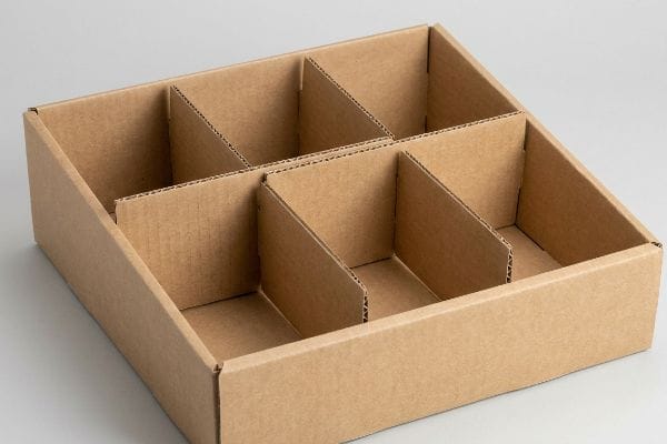 Brown corrugated cardboard retail display tray featuring six modular E-flute dividers for flexible product organization.