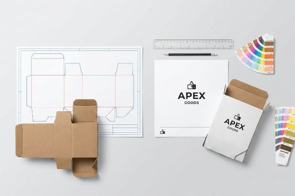 Various packaging design elements, including an Apex Goods branded box, a die-cut blueprint, and Pantone color swatches, illustrate structural engineering and surface design.