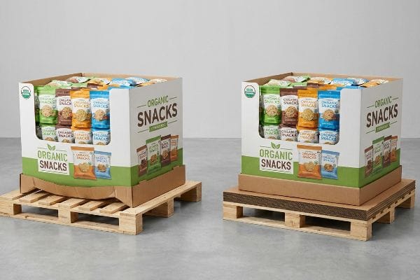 Two corrugated retail-ready Organic Snacks pallet displays on wooden pallets, one featuring a full-coverage slip sheet.