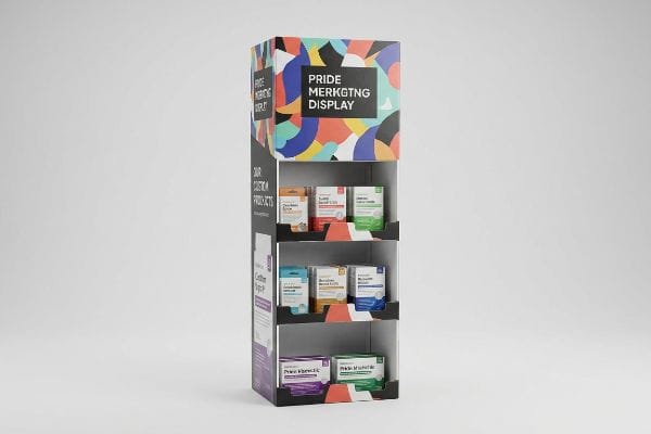 Tall paperboard retail product display featuring a 'Pride Merkgtng Display' header, three shelves of diverse products, and 'Our Custom Products' branding.