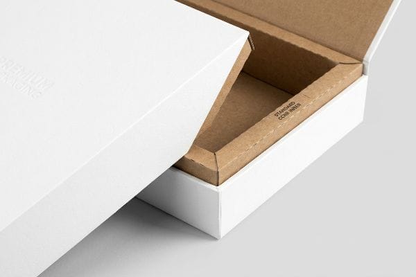 White premium packaging box, partially open, showing embossed 'Premium Packaging' and a brown 'Standard CCNB Inner' layer.