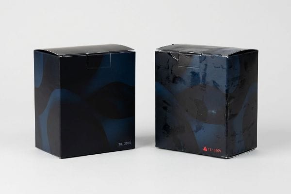 Pristine dark blue box with 'TIL: 258%' beside a smudged, offset-smeared box with 'TIL: 340%' Total Ink Limit.