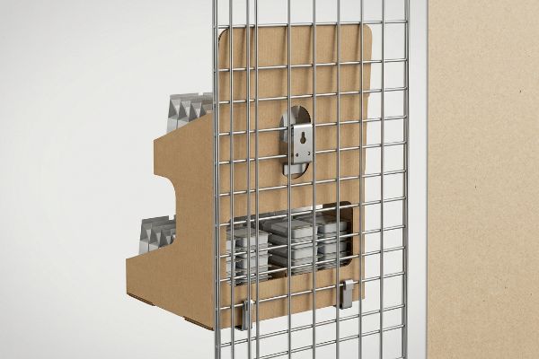 Universal metal S-bracket securing a brown corrugated sidekick display to a retail end-cap wire grid.