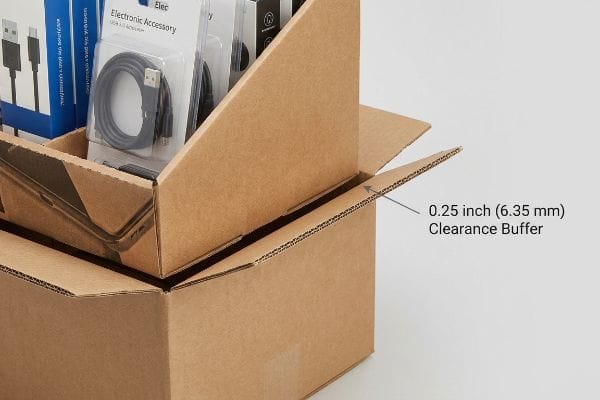 Corrugated PDQ packaging with a 0.25 inch (6.35 mm) clearance buffer, preventing friction lock for electronic accessories.