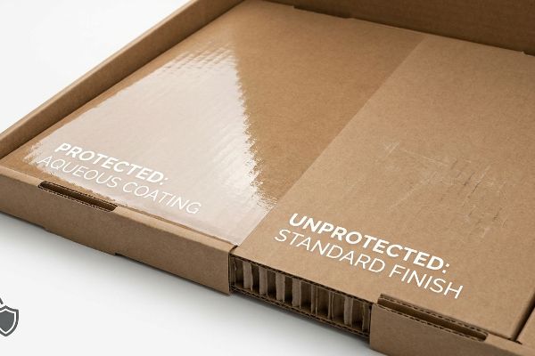 Glossy Protected: Aqueous Coating on corrugated cardboard contrasts with scuffed Unprotected: Standard Finish.