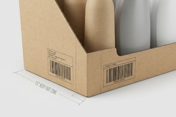 Brown corrugated cardboard retail-ready PDQ tray highlights a Logistics Label barcode and a 1.5-inch Keep-Out Zone near a structural score line.