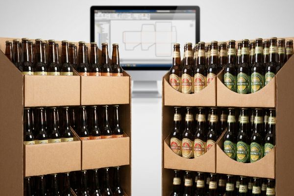 Corrugated display trays with custom die-cut swoops reveal BeerNste beer labels, demonstrating label-clearance mapping with CAD software.