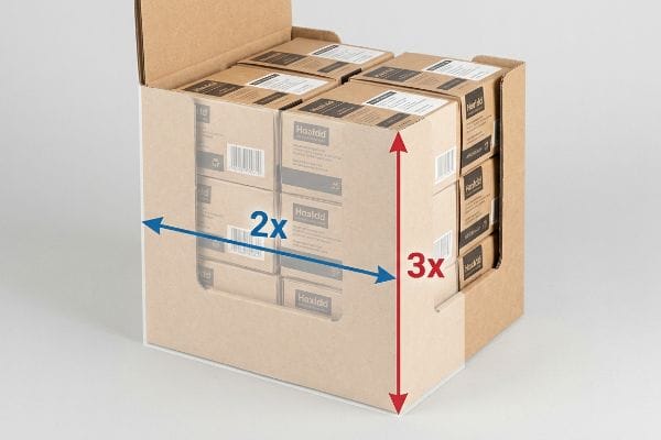 A cardboard counter display, filled with Haaldd boxes, visually demonstrates the 2x depth and 3x height ratio for stability.