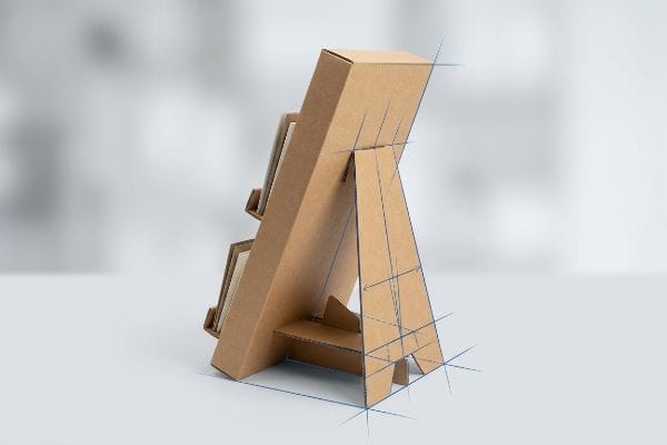 Brown corrugated cardboard counter display stand with an extended easel back, featuring blue sketch lines illustrating its structural design for stability.