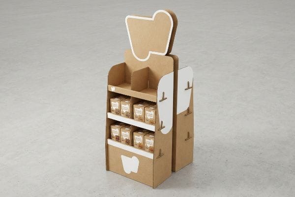 Présentoir de vente au détail en carton ondulé avec un rebord avant abaissé, mettant en valeur les produits pour une visibilité optimale dans les allées d'un entrepôt.