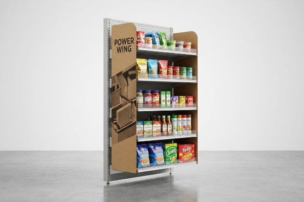 Kraft cardboard Power Wing retail display attached to an end-cap, with four shelves stocked with packaged food products.