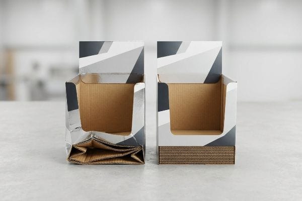 Crushed corrugated display box with visible flute damage stands beside an intact display, highlighting structural integrity issues.