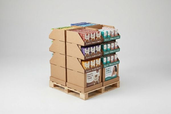 Corrugated quarter-pallet display showcasing Brand A Premium Snacks and Brand B Wellness Essentials products on wooden pallets.