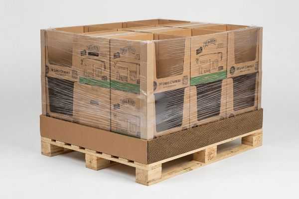 Corrugated display boxes for Mr. Lolo Choices and Mr. Baker, secured with stretch wrap on a wooden pallet, featuring a protective corrugated slip sheet.