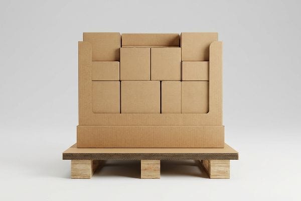 Brown corrugated cardboard boxes stacked in a partial retail display on a wooden pallet with a visible corrugated slip sheet.