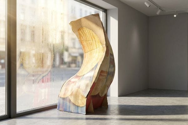 Curved Window Display Unit A curved, layered corrugated display unit stands in a sunlit gallery window, showcasing its unique design and material texture.