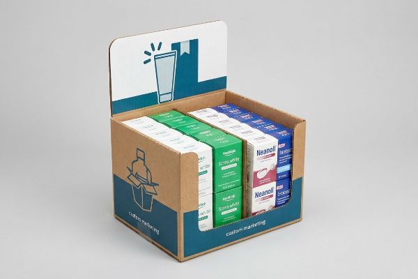 A retail corrugated cardboard display box engineered for products like Healtalk, Scora White, Neanoll, and biotrek, featuring custom reordering and marketing graphics.