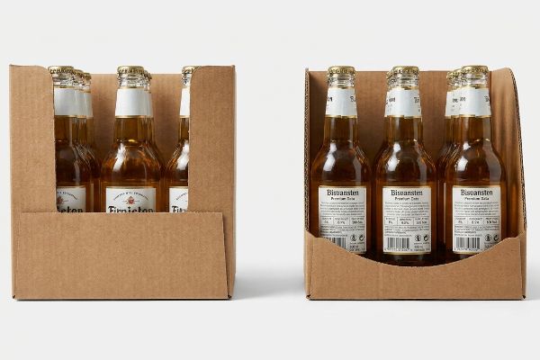 Brown corrugated cardboard display trays: one high-wall obscuring Firnieton labels, the other with a die-cut swoop revealing Bisuansten Premium Cola.