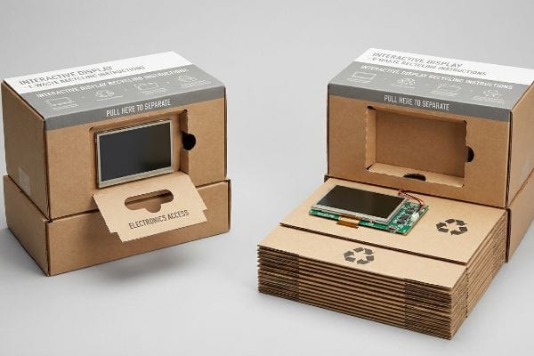 Brown corrugated cardboard interactive display with E-Waste Recycling Instructions, showing an Electronics Access pull tab for screen separation.