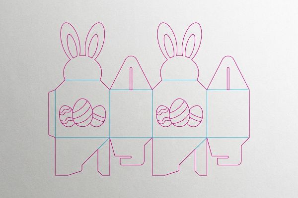 Detailed die-cut template for two Easter bunny boxes, showing egg designs, magenta cut lines, and cyan crease lines.