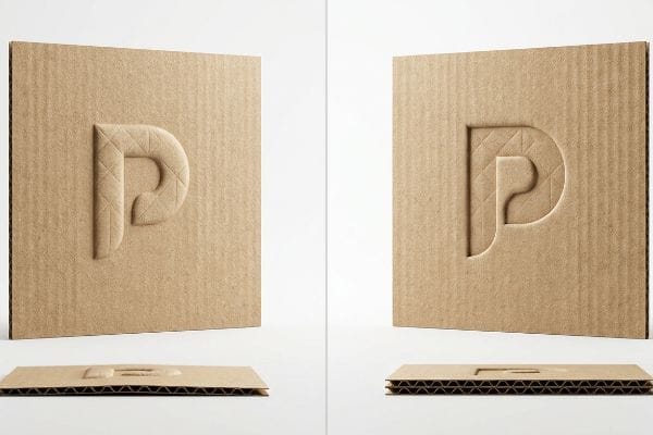 Corrugated cardboard samples with a cross-hatch embossed 'P' on the left and a debossed 'P' on the right, illustrating tactile texture and flute compression.