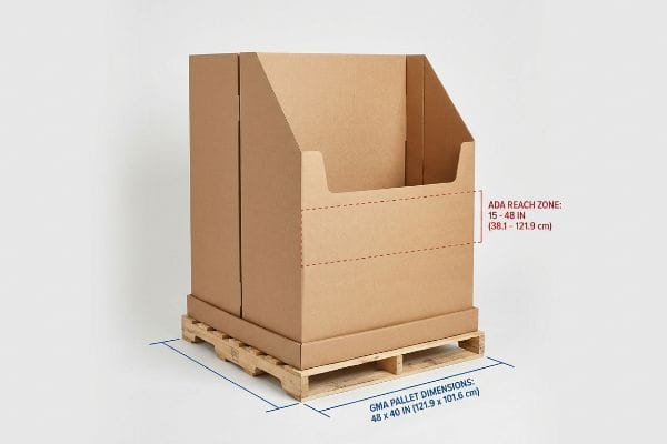 Brown corrugated floor display on a wooden pallet, highlighting ADA Reach Zone 15-48 inches and GMA Pallet Dimensions 48x40 inches.