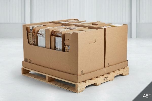 Brown corrugated half-pallet display on a GMA wood pallet, filled with packaged goods, featuring a 48-inch width for fractional merchandising.