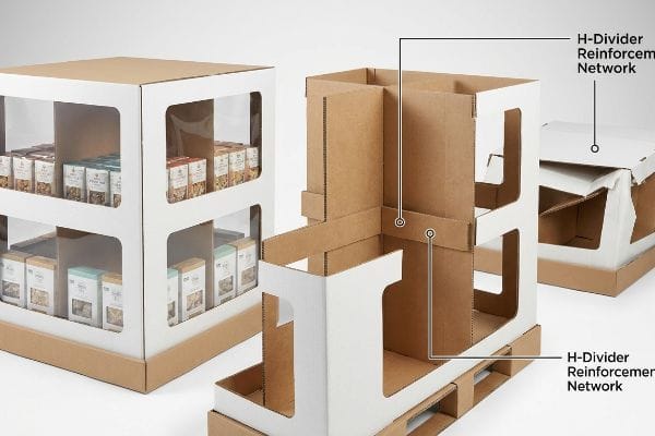 White and kraft corrugated window displays, one filled with products, another revealing its H-Divider Reinforcement Network for structural support.