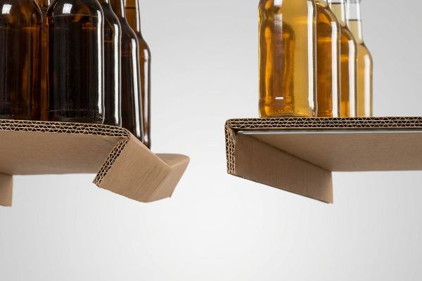 Corrugated cardboard shelves for bottles, contrasting a standard folded edge with a hidden metal support bar.